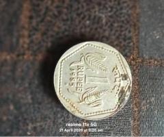 One rupee coin H mark