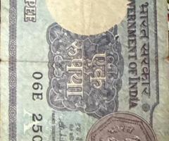 Old one rupee note year 1986
