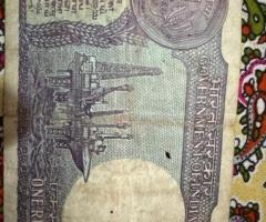 Old one rupee note year 1986